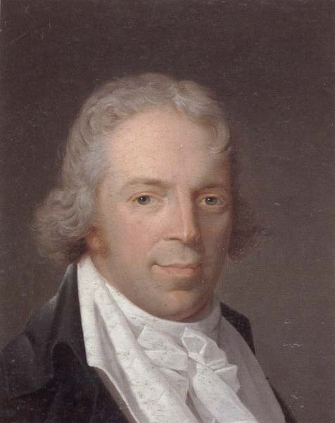 Portrait of a man,head and shoulders,wearing a grey jacket and a white cravat